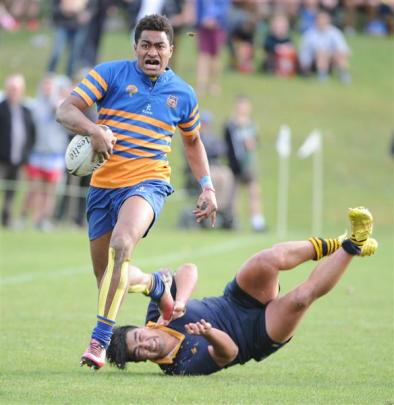 Taieri's Ben Grant charges up field  against Dunedin in the colts rugby final.  Photos by Craig...