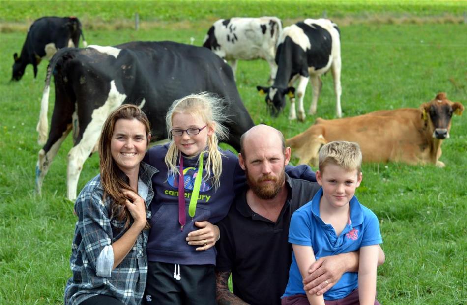 Taieri sharemilkers Bridget and Rob Berry, with their children Eva and Oscar, are doing...