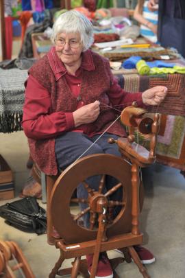 Sue Lloyd, of Taieri Creative Fibre, spins yarn.