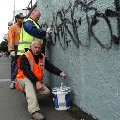 Task Force Green graffiti team leader Neil Ivory (front) 
...