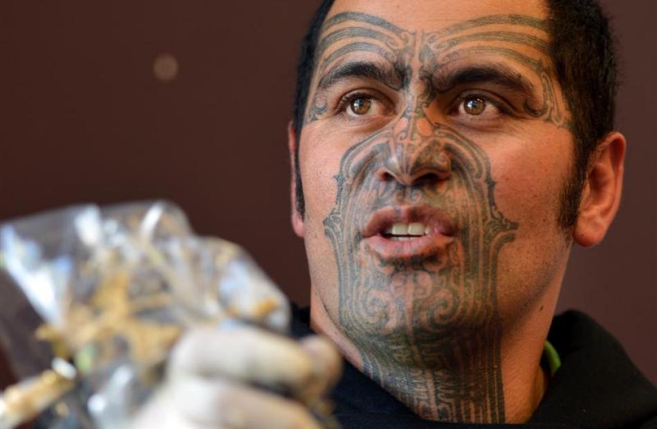 Tauranga ta moko artist Stu McDonald takes a break from working on Kees Meeuws at a Ta Moko...