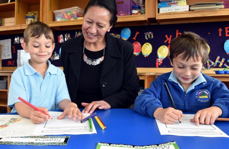 Te Kura Kaupapa Maori o Otepoti principal Tiahuia Kawe-Small works with pupils Tawera Campbell ...