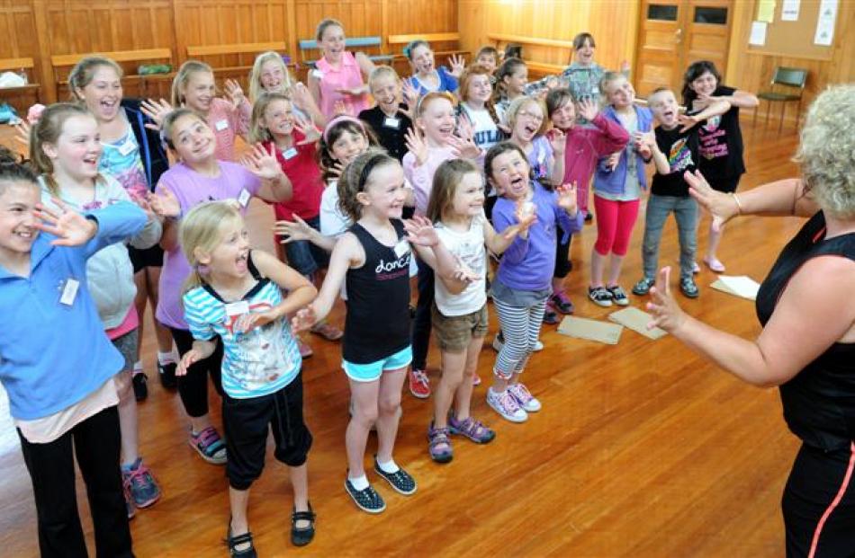 Teacher Denise Henderson leads young performers at the Musicool theatre and dance summer school...