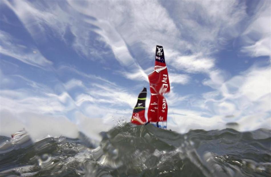 Team New Zealand sails before the third race of its Louis Vuitton Cup challenger series against...