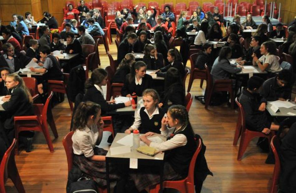 Teams get down to the task at hand at Otago Girls' High School last night. Photo by Linda Robertson.