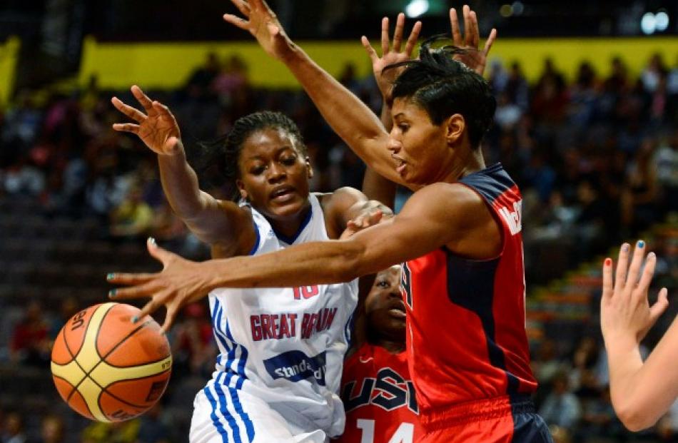 Temi Fagbenle of Team GB (L) challenges Angel McCoughtry of Team USA during their Olympic women's...