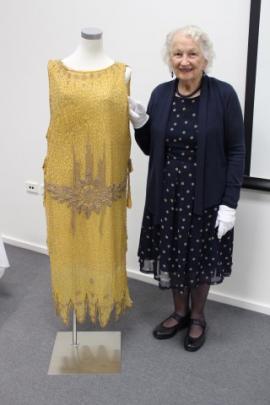 Textiles historian Margery Blackman with a late 1920s dress from the Dunedin Art Gallery's...