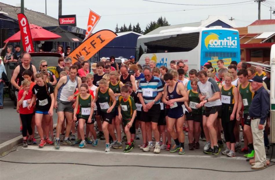 The 103 runners in Kelly's Canter set off from the Palmerston Railway Station yesterday for the...