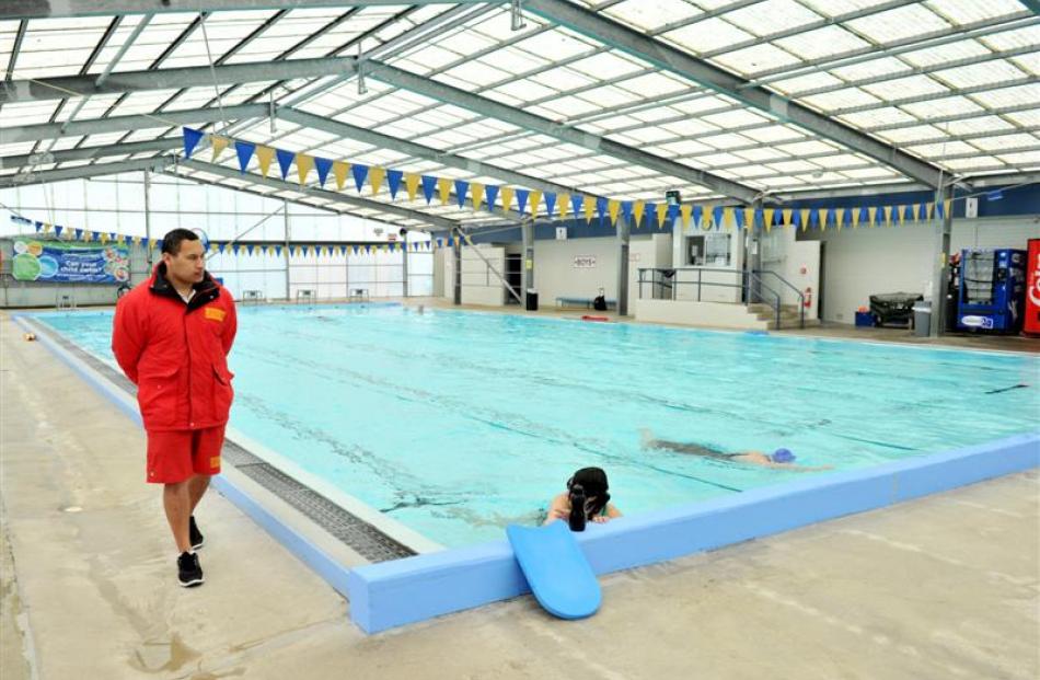The ageing Mosgiel pool under the watchful eye of supervisor Punua Tangimetua. Photo by Linda...