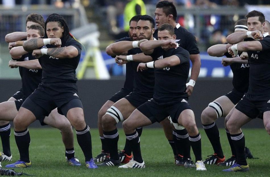 The All Blacks perform the haka before their test against Italy at the Olympic stadium in Rome...