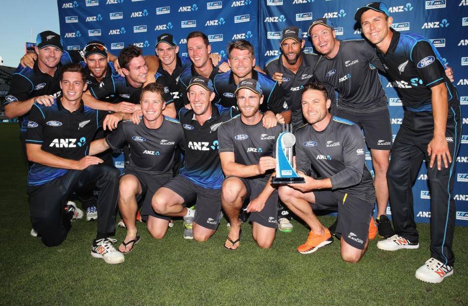 The Black Caps celebrate after winning the One Day International match between New Zealand and...