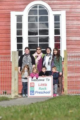 The Brighton schoolhouse as it is today, with Little Rock Preschool pupils (front, from left)...