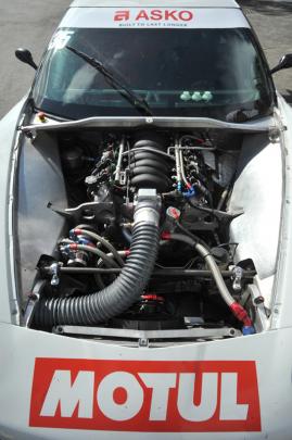 The business end of a Corvette racecar. Sadly it's not moving much as a small part of the engine...
