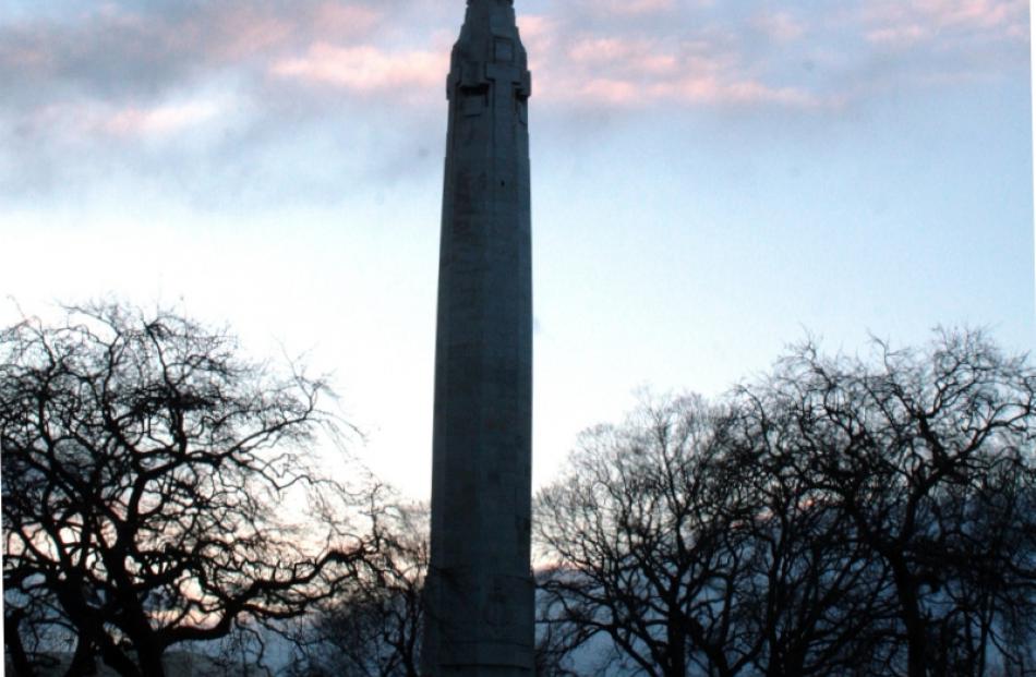 The Cenotaph in shadow against the morning sky. The monument and everything else in Queens...