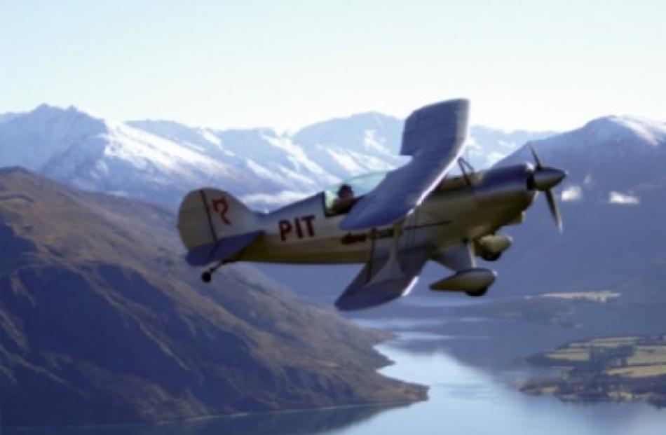 The Classic Flights Pitts Special aerobatic plane takes to the air above Lake Wanaka. Photos by...