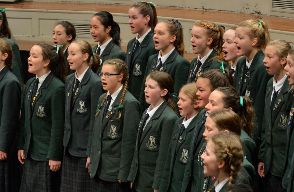 The Columba College junior choir performs ' Something in the Water' at the Big Sing held at the...