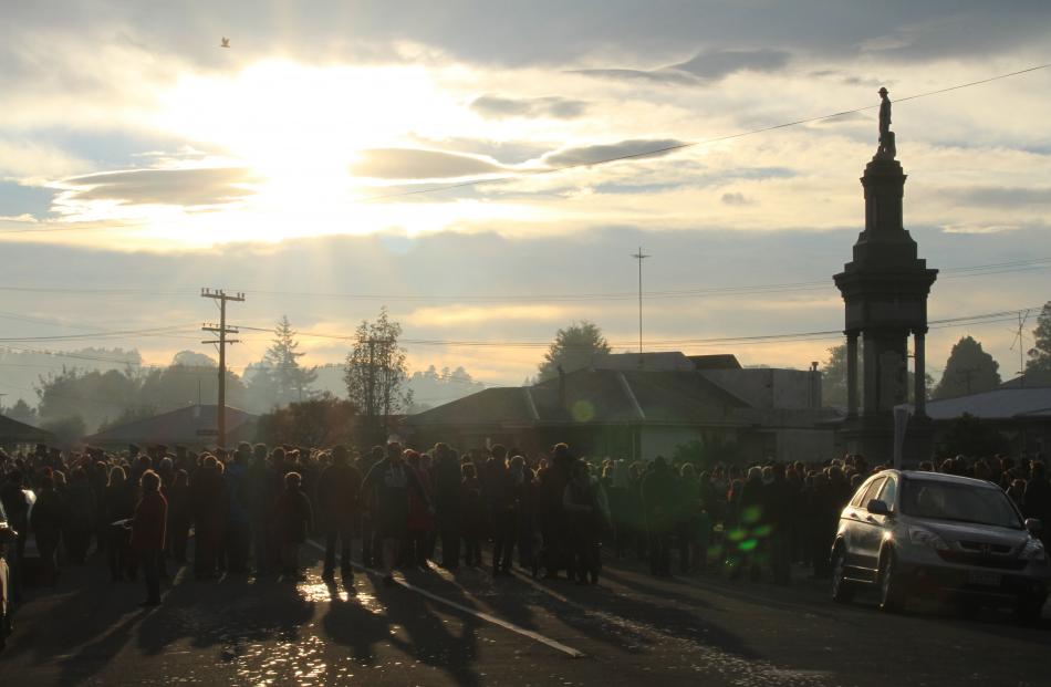 The crowd at the service at the Balclutha cenotaph were asked to think of the town 100 years ago...