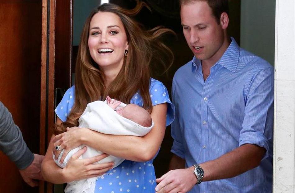 The Duke and Duchess of Cambridge emerge from St Mary's Hospital with their baby boy yesterday....