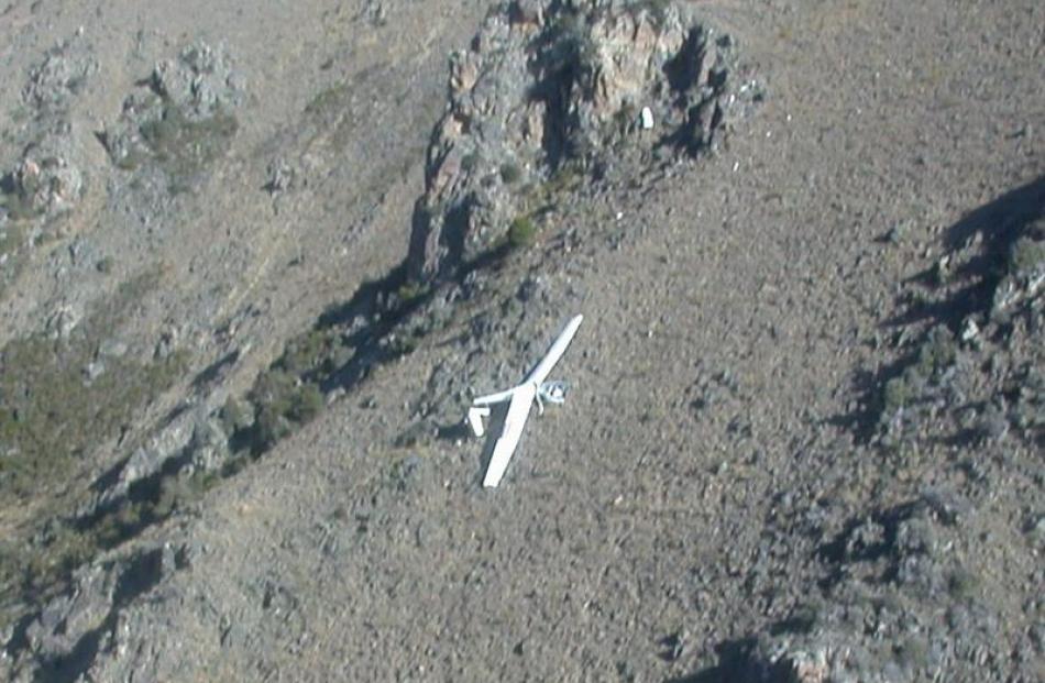 The Duo Discus glider, above, which crashed into Mt St Cuthbert, overlooking Omarama, yesterday....