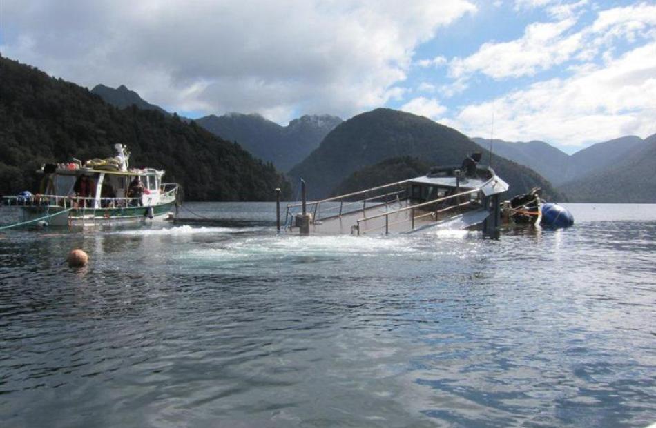 The fishing vessel Karaka is raised from the bed of Breaksea Sound, in Fiordland, one of the two...