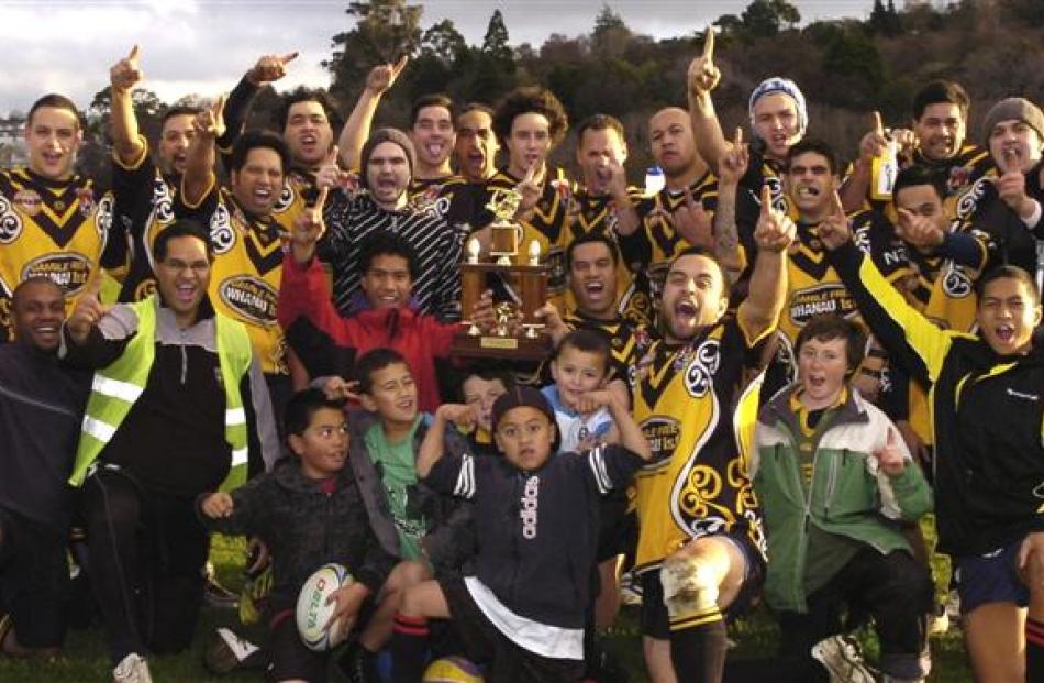 The Kia Toa Tigers celebrate winning the Dunedin competition on Saturday at the Oval.