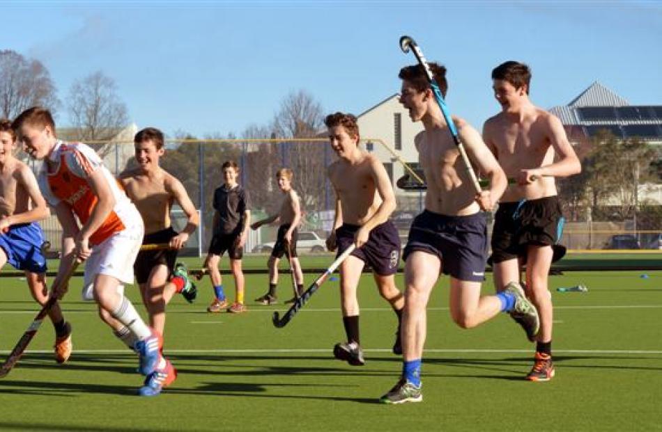 The Kings High School first hockey team had a hit-around on the hockey turf playing ''skins''...