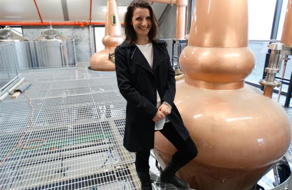 The manager of the new Cardrona Distillery and Museum, Jennie Whitlock, with the stills made by...