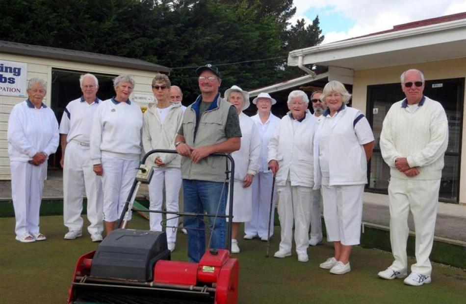 The newly arrived greenkeeper at the Waikouaiti Bowling club, Russell Jenkinson (front), with...