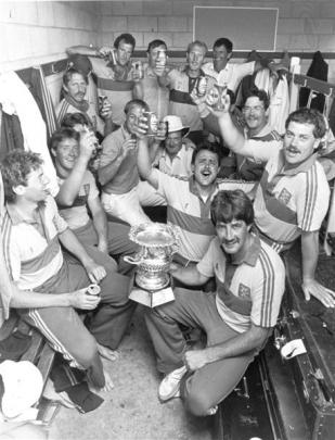 The Otago cricketers, with Warren Lees in front holding the trophy, celebrate Shell Cup victory...