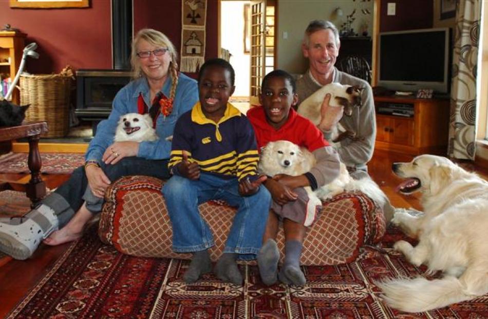 The Potts (from left) Chris (holding Kidogo), Francis, Raymond (holding Bwana), Michael (holding...