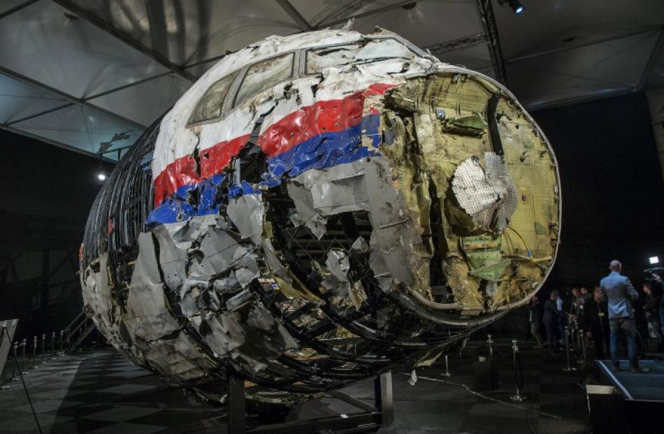 The reconstructed wreckage of the MH17 airplane on show in Gilze Rijen, the Netherlands. Photo...