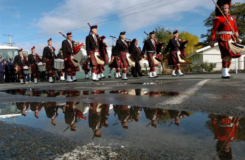 The RSA Taieri Pipe Band perform in a Middlemarch Anzac Day service. Photo by Stephen Jaquiery.