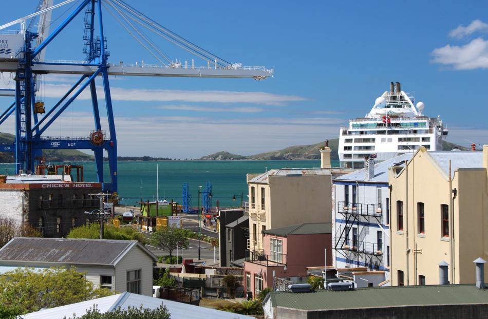 The salmon-coloured Seafarers' Centre (middle foreground) nestled among taller buildings in the...