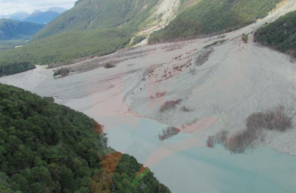 The site of the huge landslip down across the valley. Photos by DOC.