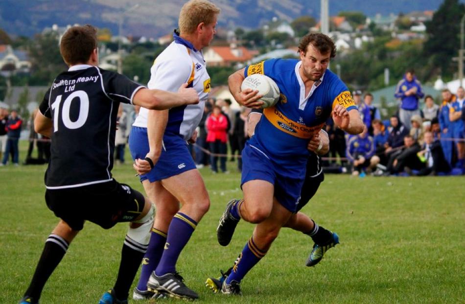 The Taieri halfback charges for the tryline.