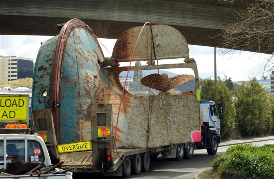 The Te Whaka stern is transported along Wharf St yesterday. Photo by Stephen Jaquiery.