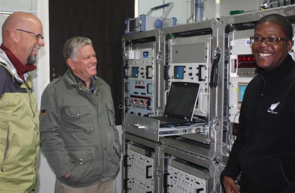 The telemetry technicians working at the Awarua tracking station, Herman Steenkamp (left) and...