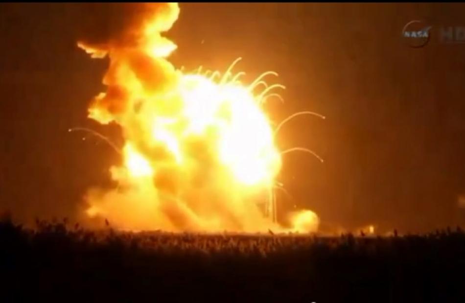 The unmanned Antares rocket is seen exploding seconds after liftoff in this still image from NASA...