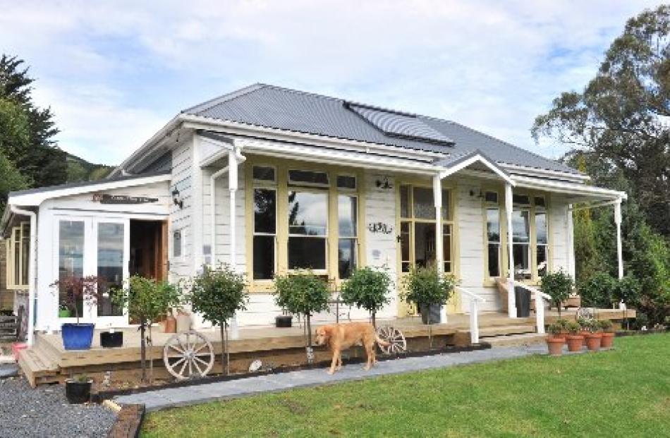 The villa was built in 1914 and the sunroom added on the side in 1930. Photos by Linda Robertson,...