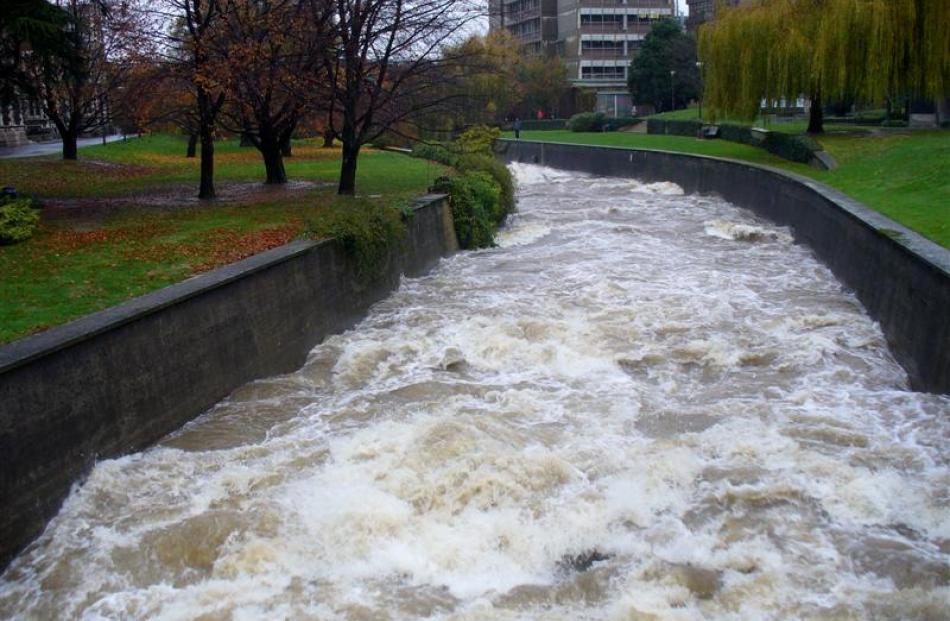 The Water of Leith running high near the University of Otago foot-bridge. Photo by Webfeatpix