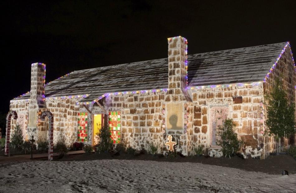 The world's largest gingerbread house, located in Bryan, Texas, has an edible exterior mounted...