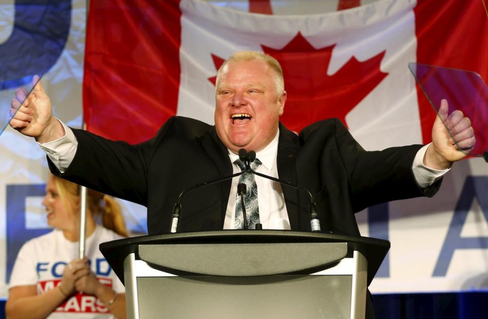 Then Toronto Mayor Rob Ford reacting on the podium during his campaign launch party in Toronto in...