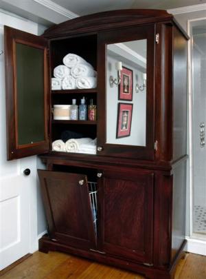 This TV unit is used as a linen closet. The cabinets were rehinged to hold two clothes hampers...