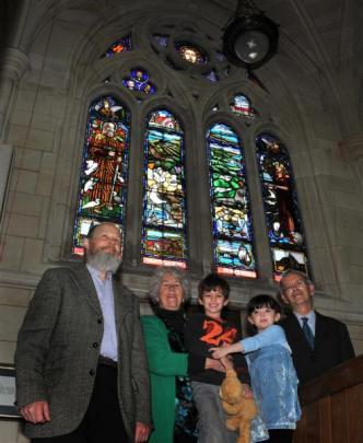 Thrilled to see their window on display are (from left) Maia stained glass artist Peter Mackenzie...