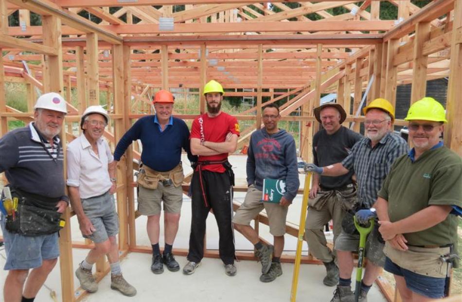 Tirohanga Camp manager Matt Stevenson (fourth from left), builder Darren Edwards (fifth from left...