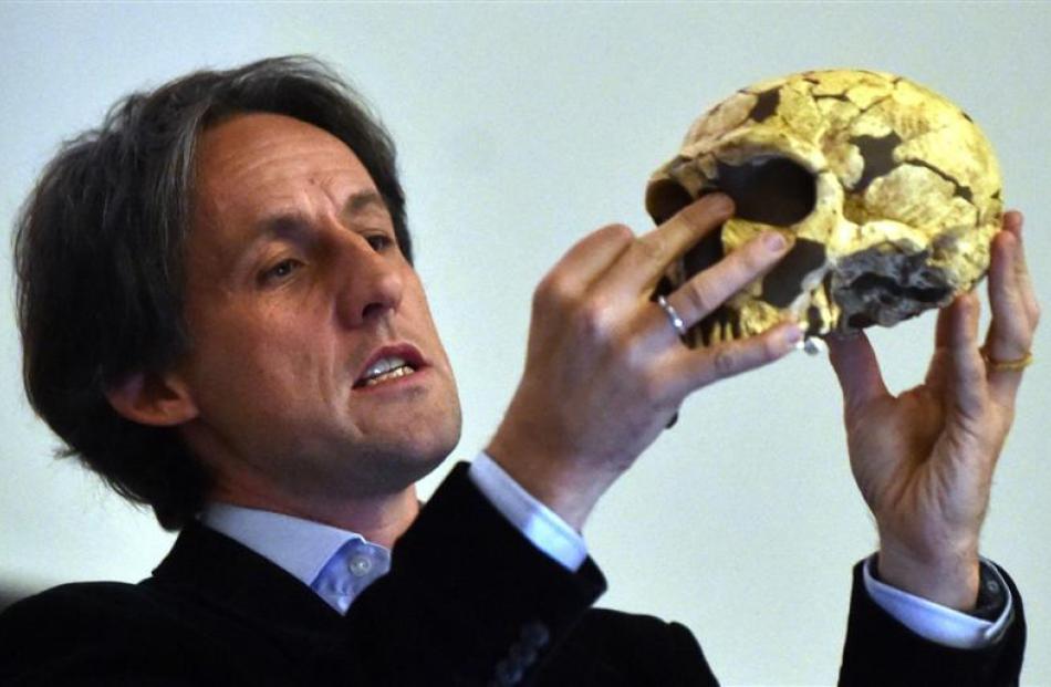Tom Higham presents a reconstruction of a Neanderthal skull to the audience at the University of...