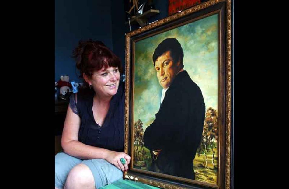 North Taieri woman Cat Hunter admires the oil painting of Tom Jones she purchased in Perth for ...