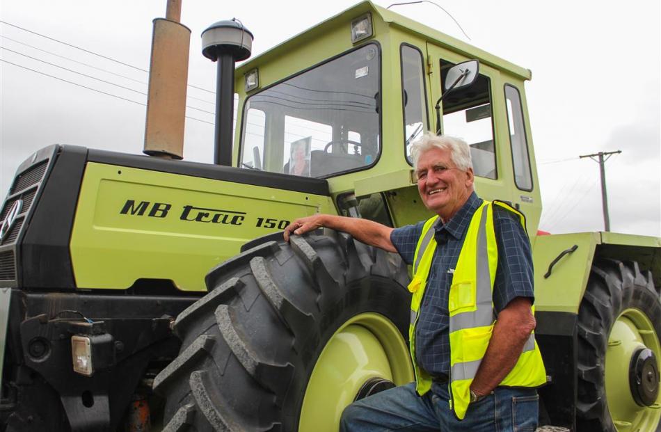 Tractor Trek organiser Phil Aish relaxes in Tapanui with  the tractor  he is driving the length...