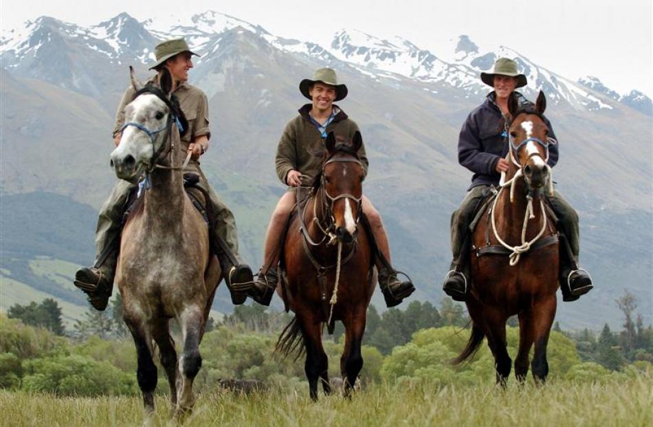 Trent Anderson, Malcolm Gibson and Ben Nielsen-Vold ride home from a day's work on Mt Nicholas...