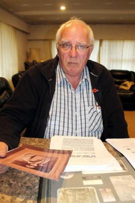 Trevor Hobbs, of Invercargill, reads information about his  great-uncle Albert (Bert) Appelbe....